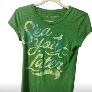 Green Aeropostale shirt sz medium w/rhinestones on some letters